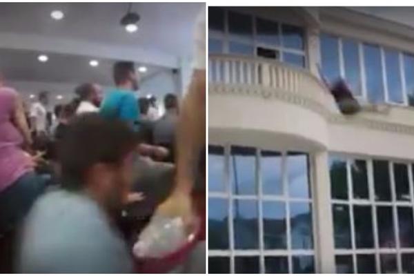 BIZNISMEN USTAO USRED SASTANKA I BACIO SE S BALKONA: Radnici počeli da vrište i paniče! (VIDEO)